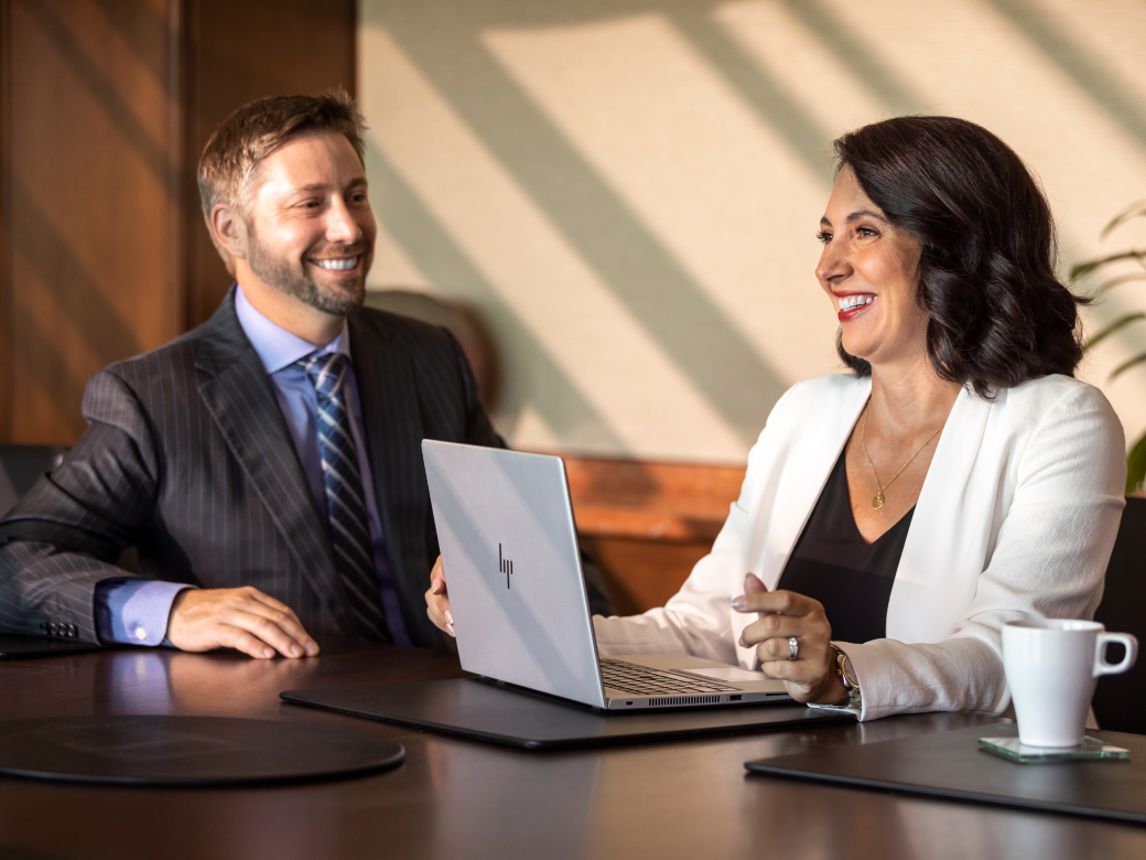 Two people talking in an office